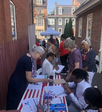 Helping new U.S. citizens become voters July 4, 2025 (photo by J. Chambers)