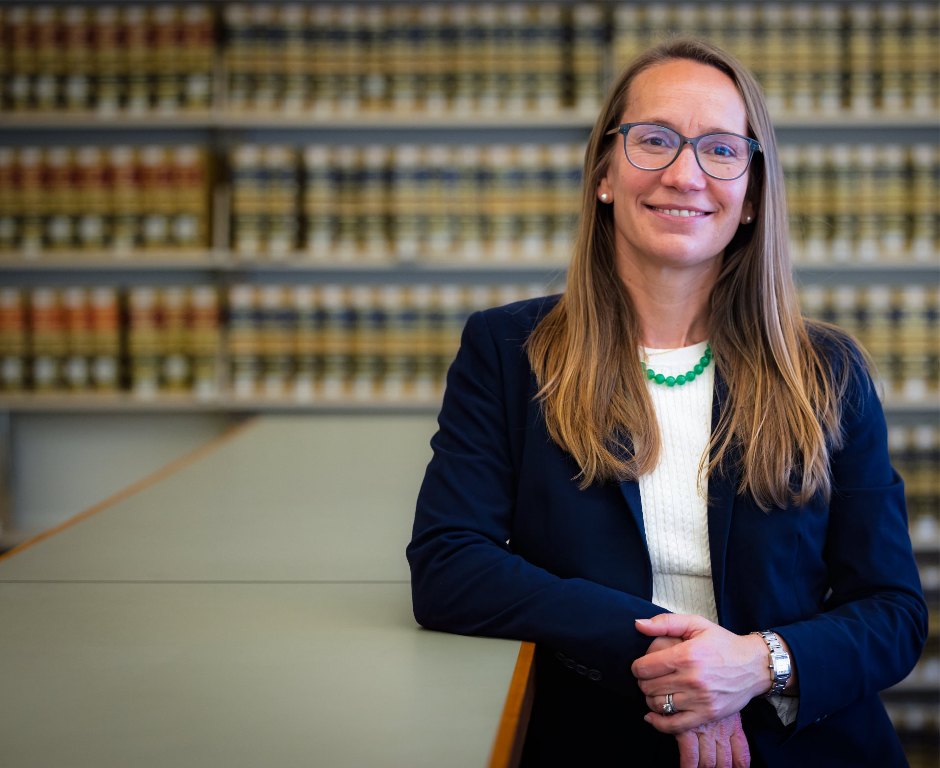 Phoebe_Maffei_in_Law_Library_leaning_on_bookcase_desktop.jpg