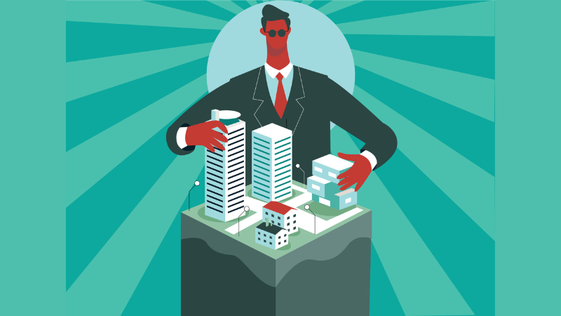 Man in suit towering over a group of buildings