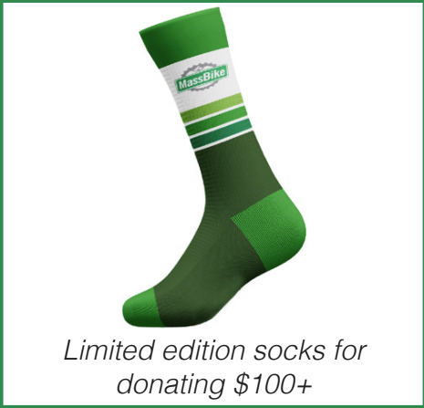 limited edition socks for donating $100+, sock description: a green sock with a wide white stripe toward the top with the massbike logo. three stripes of darkening colors of green give way to a dark green foot and middle green toe and heel