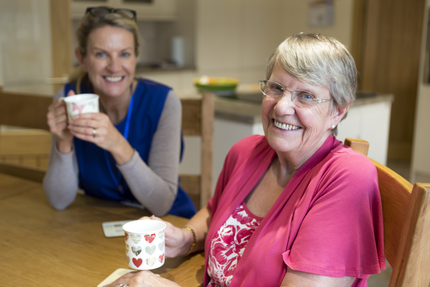 women enjoy cup of tea