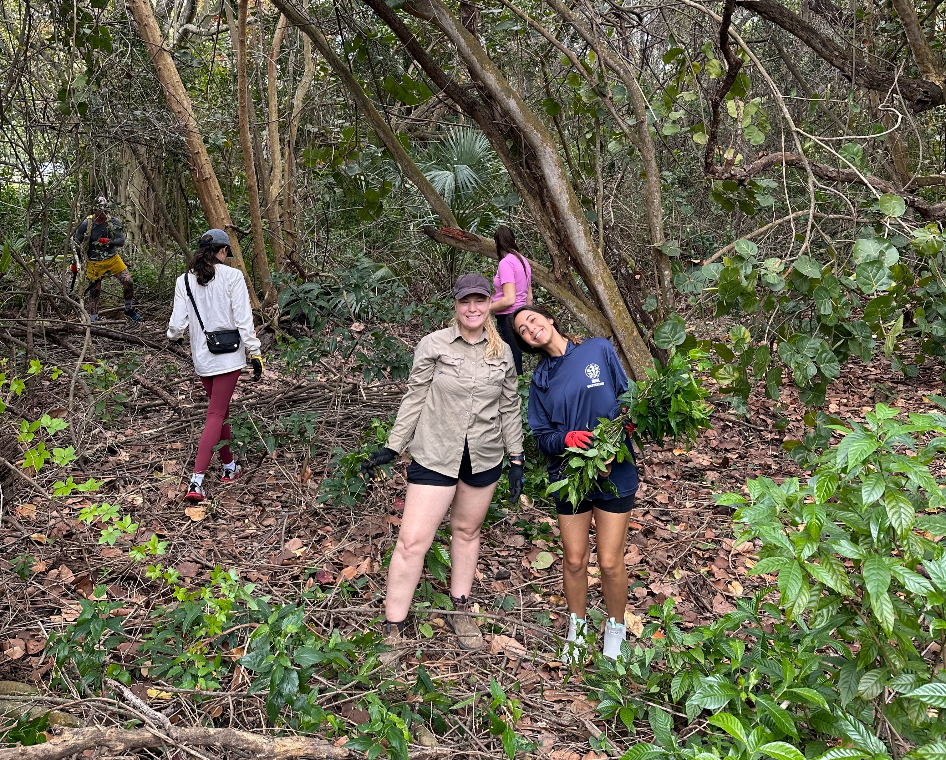 Two volunteers at a habitat restoration event.