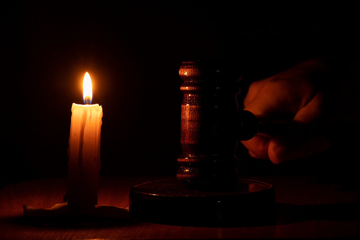 A candle and a gavel.