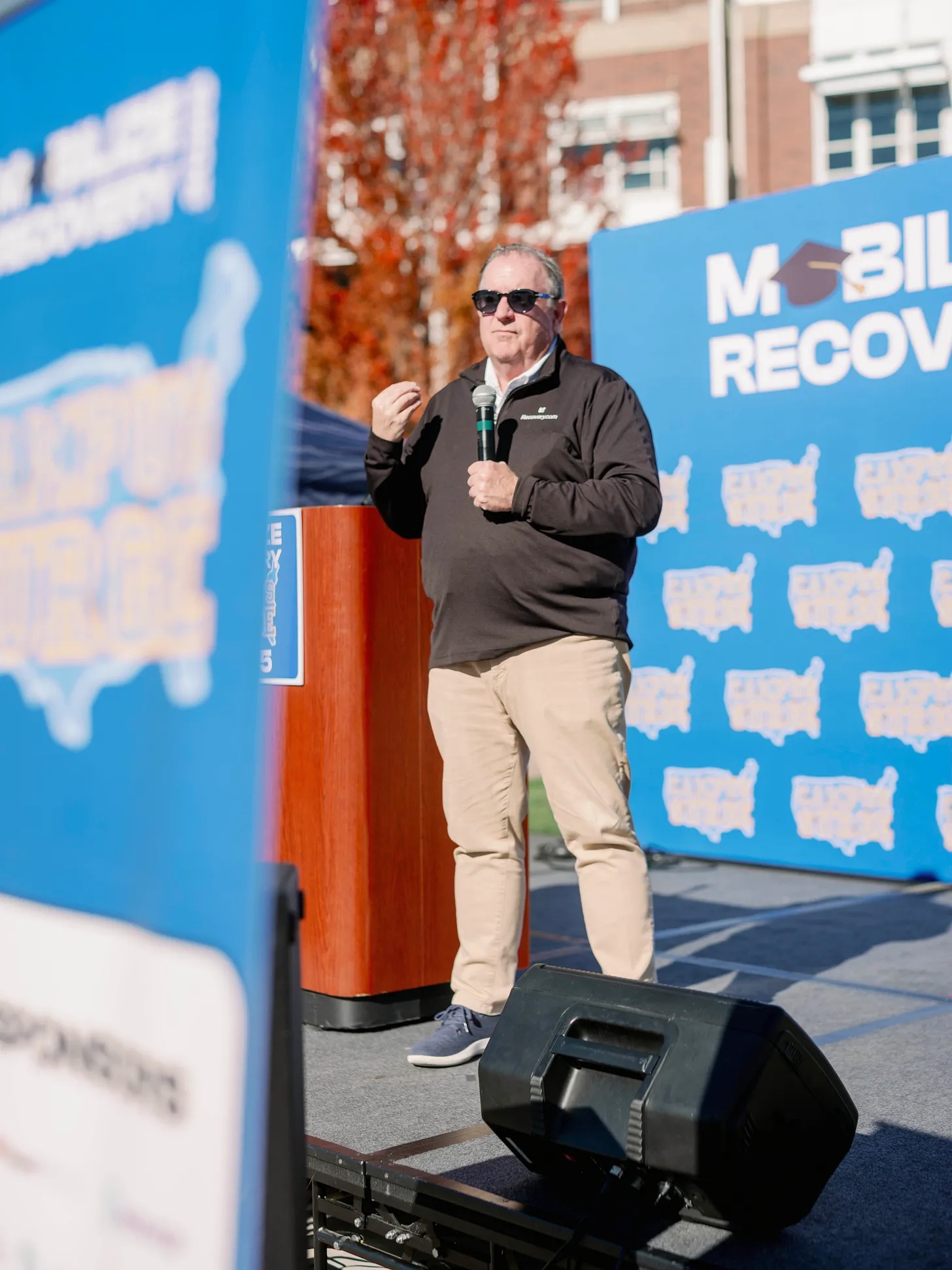 Tom Farley speaking on stage at Campus Surge Reno event