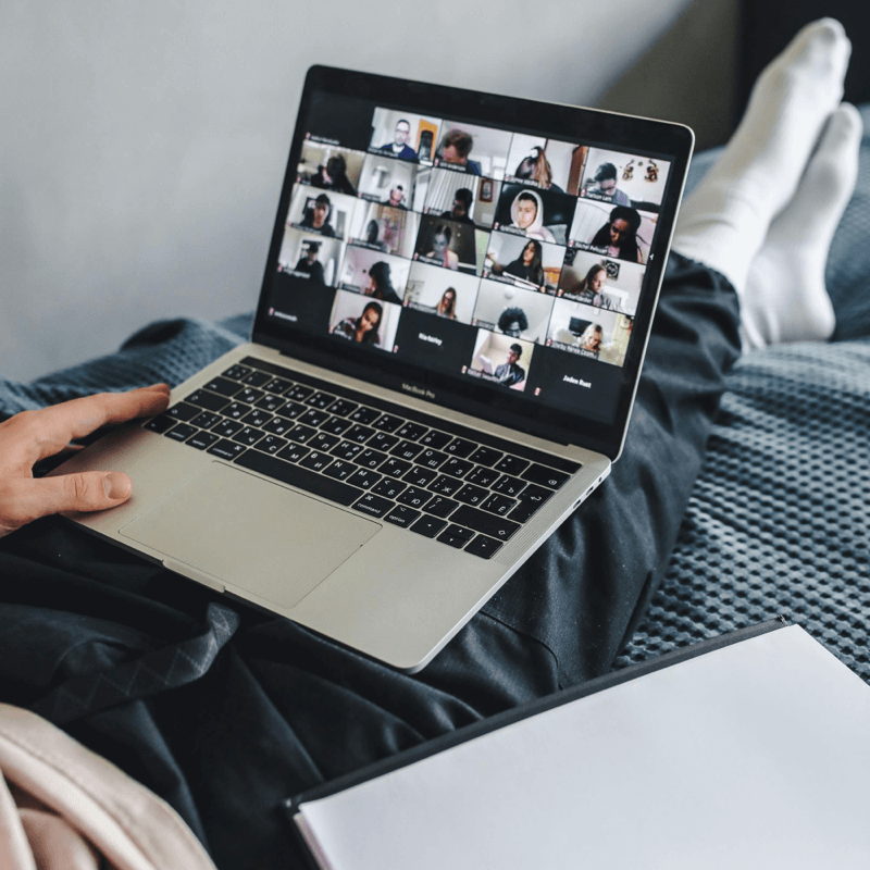 Person attending zoom webinar on their laptop