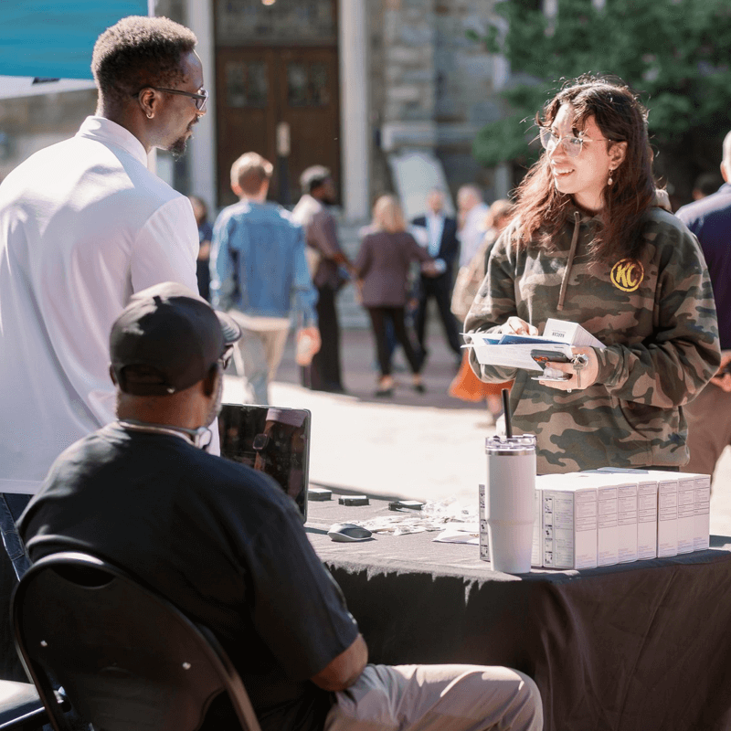 Person getting life saving resources at Campus Surge 2025 event