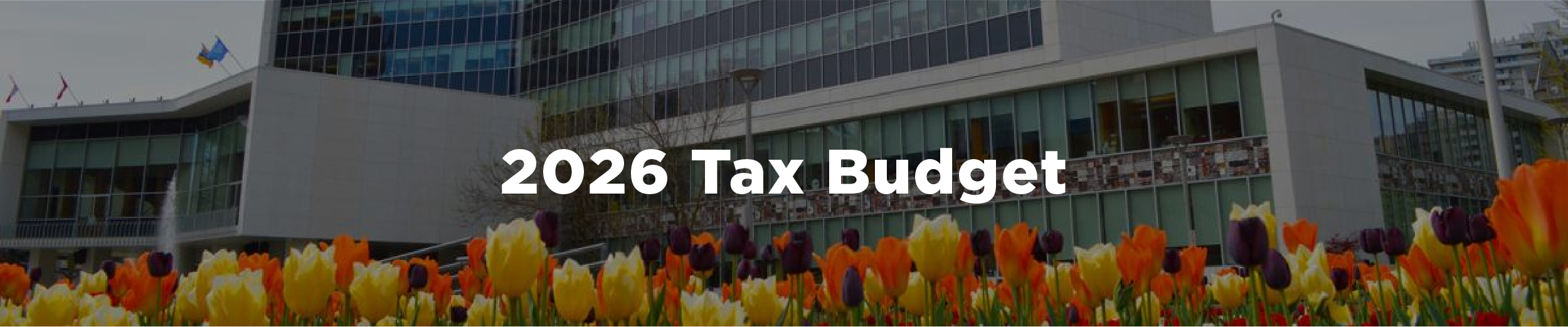 An image of Hamilton city hall in the spring with tulips blooming and the overlaid text 2026 Tax Budget