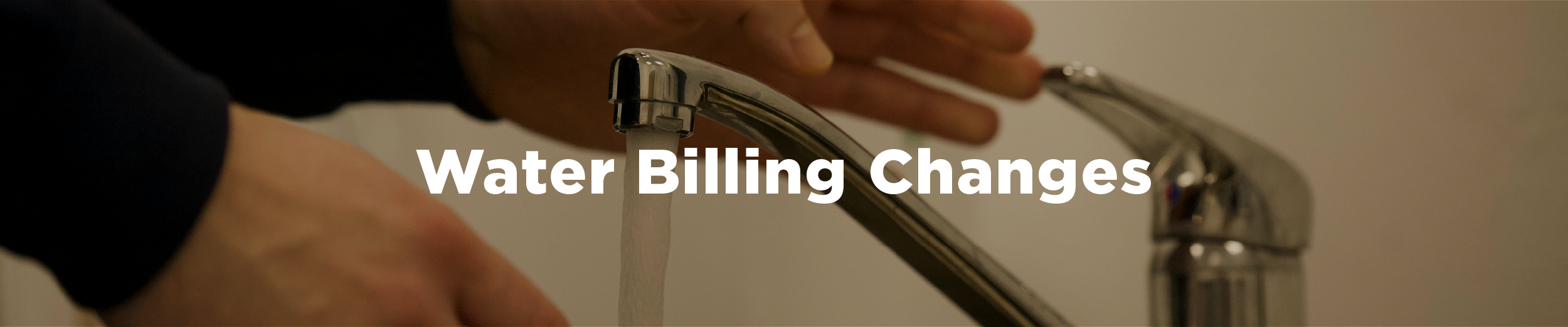 A man's hands in the process of turning off a faucet that is on with the overlaid text "Water Billing Changes"