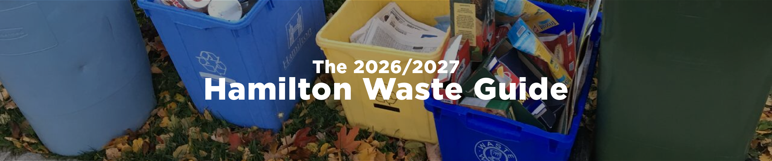 A photo of a garbage can, Hamilton recycling bins, and a Green Bin in the fall in front of a brown wooden fence with the overlaid text "The 2026/2027 Hamilton Waste Guide"