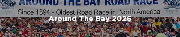 A group of runners at the starting line of the Around the Bay road race with the overlaid text "Around The Bay 2026"