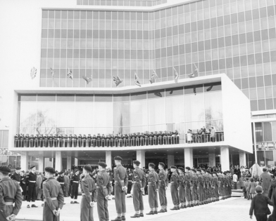 The opening day of the new City Hall with soldier standing at attention to show respect for Governor General Vanier.