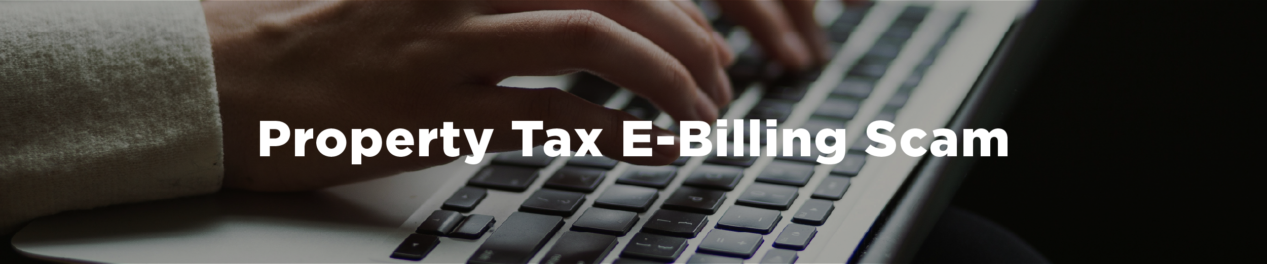 A person typing at a laptop with the overlaid text "Property Tax E-Billing Scam"