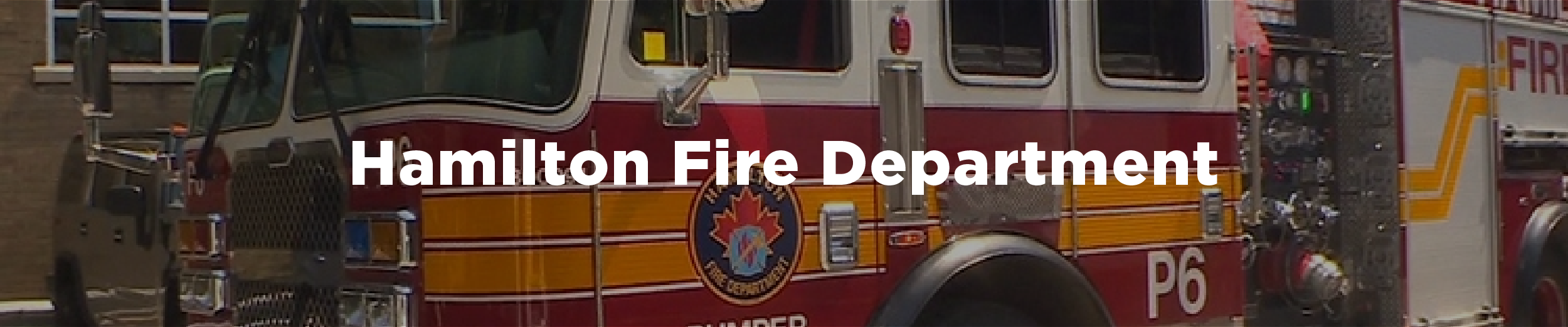A Hamilton Fire Department truck in front of a fire station with the overlaid text Hamilton Fire Department