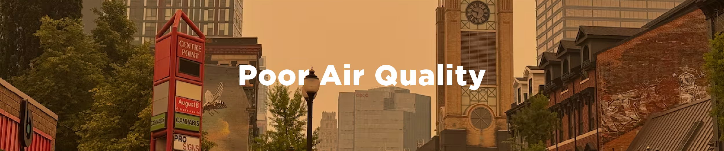 An image of James Street North at York Boulevard looking south towards the escarpment on a day when the air quality is poor thanks to wildfire smoke with the overlaid text "Poor Air Quality"