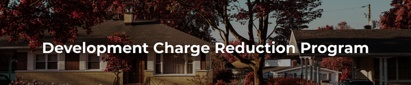 Small houses in fall with the leaves on the trees turning red and the overlaid text "Development Charge Reduction Program"