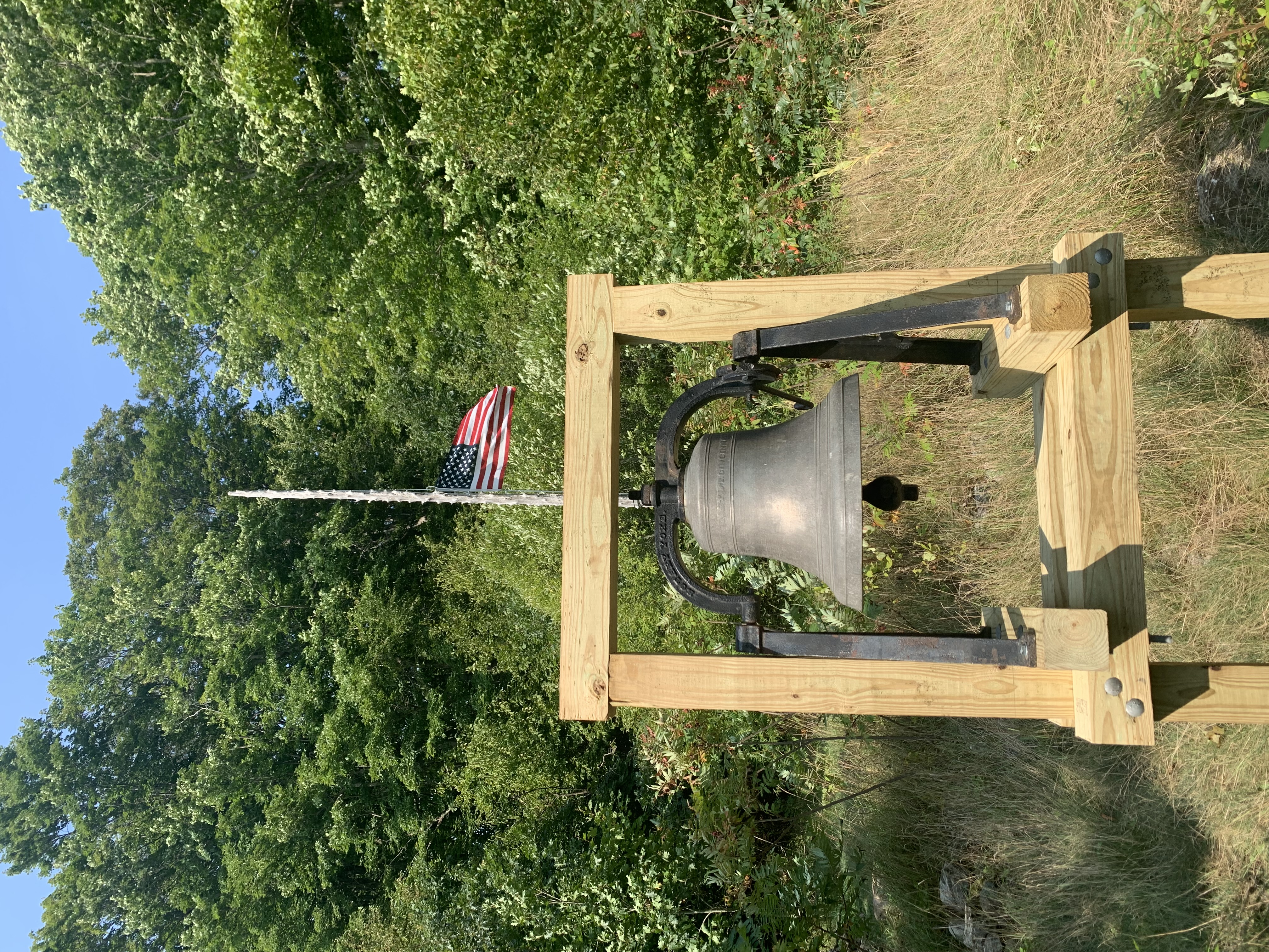 School bell with flag