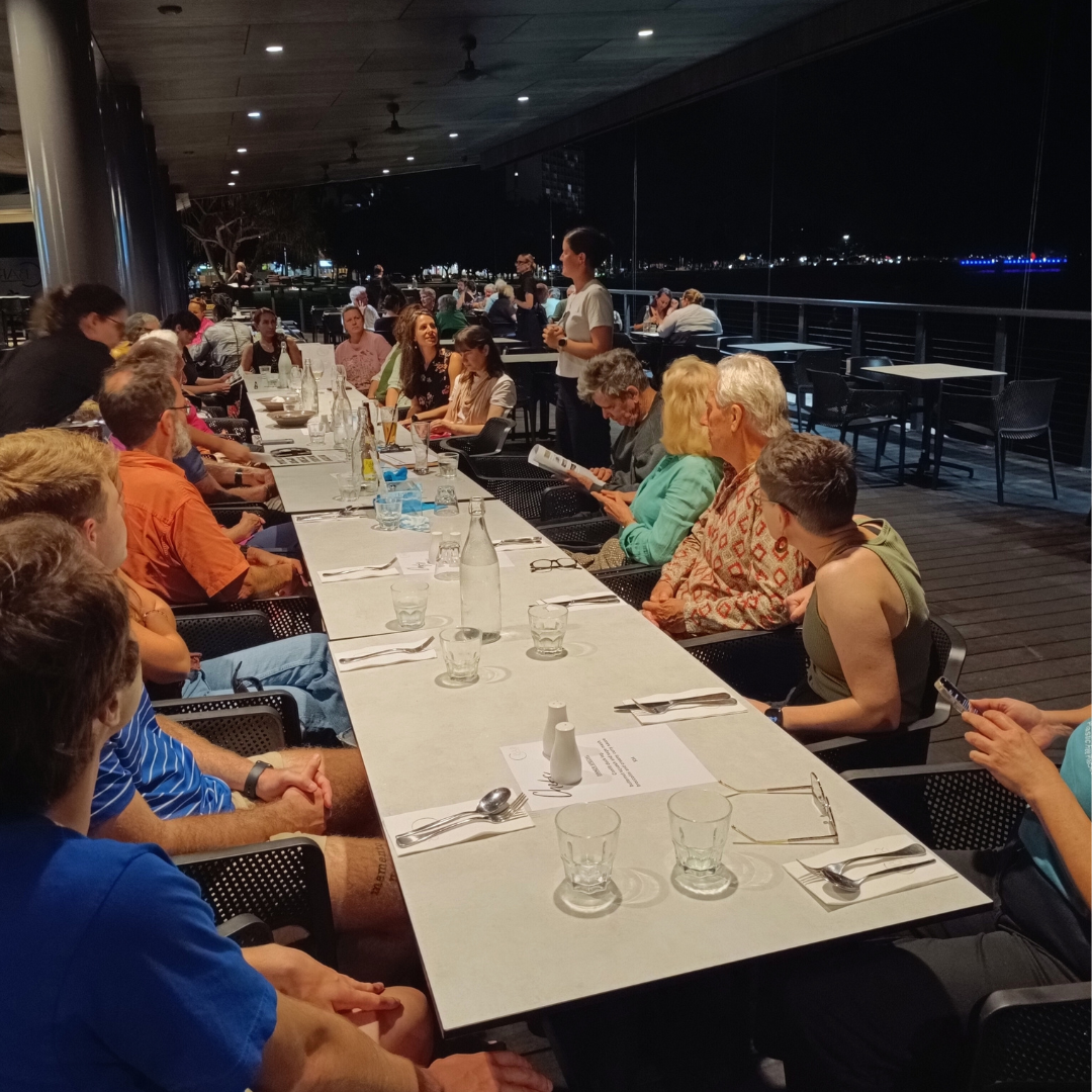 Green Drinks attendees sit around a table