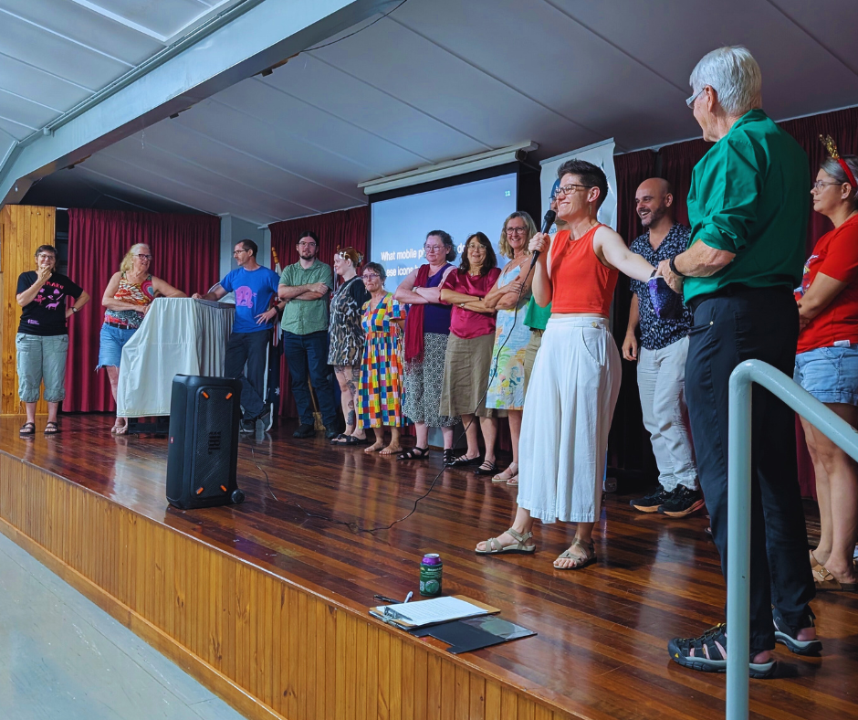 Trivia game contestants and MC on the stage