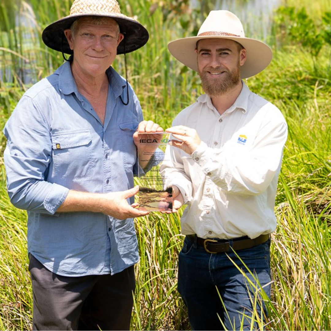 Greg and Tyson from Townsville City Council hold an award