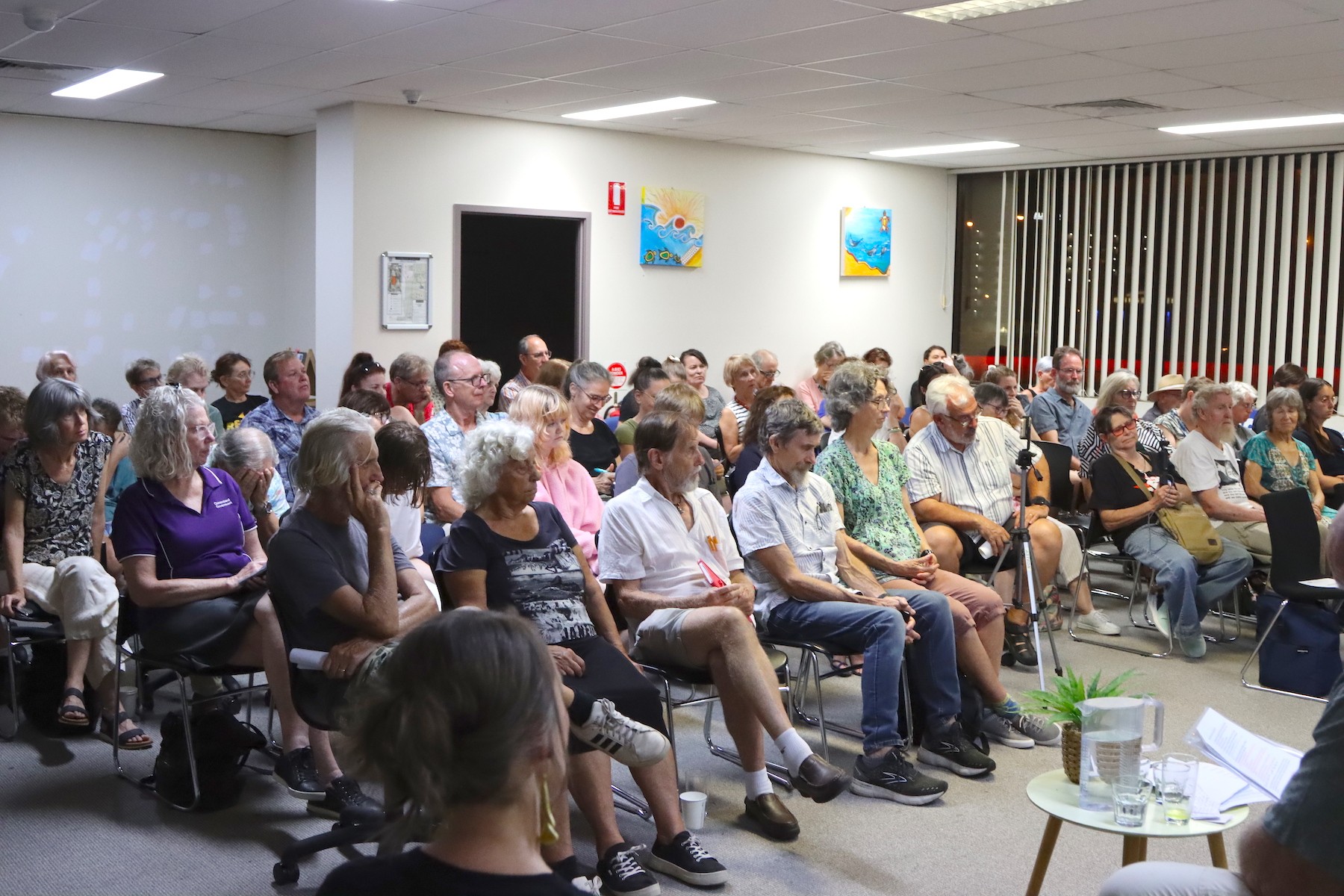 Audience members listen intently