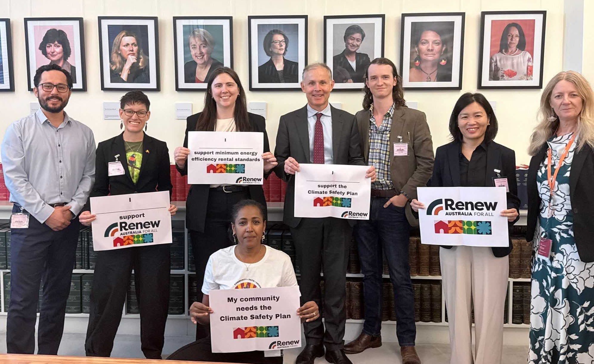 Renew Australia for All delegates with MPs holding signs in support of a Climate Safety Plan