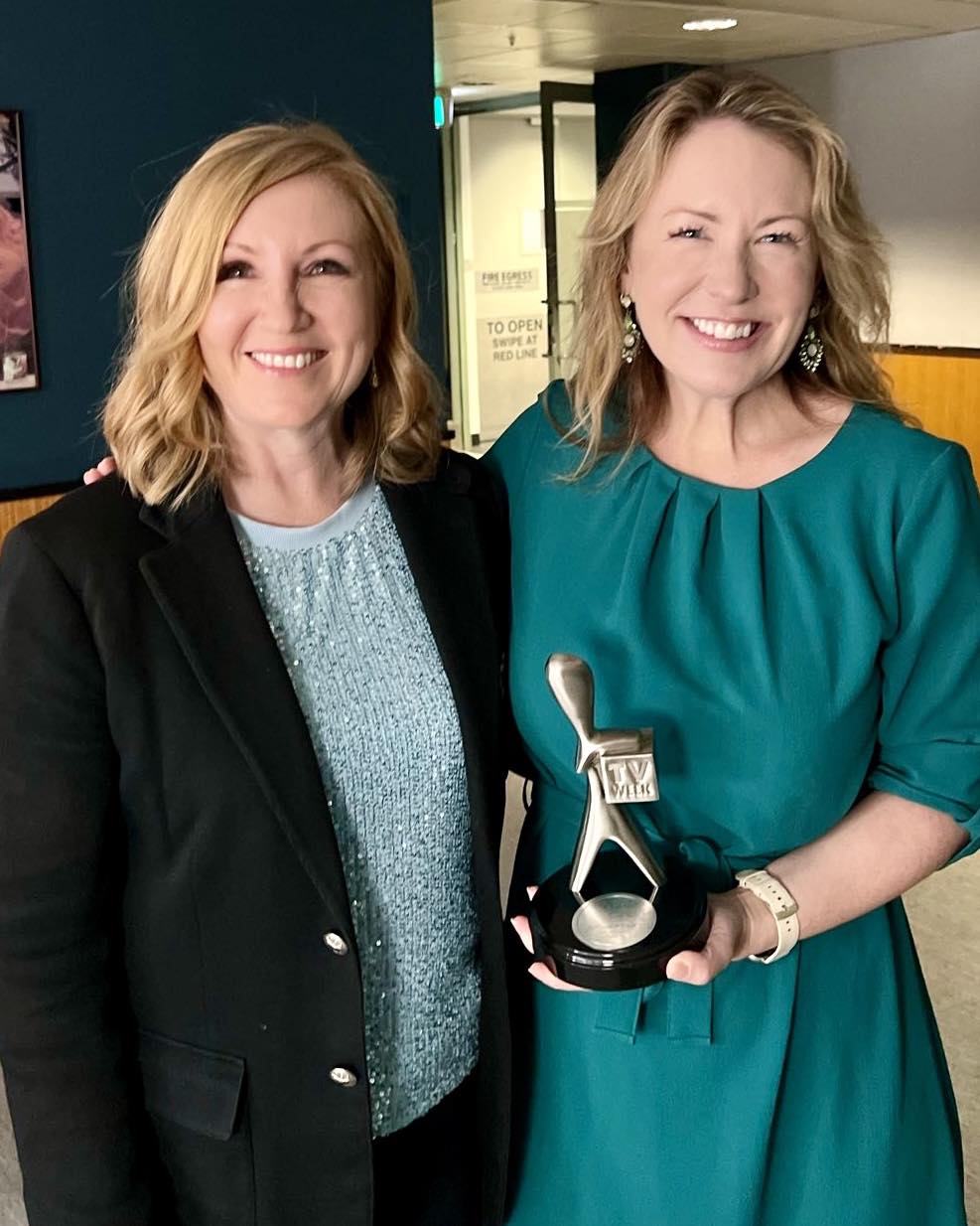 Photo of Abigail Boyd and Adele Ferguson smiling while holding an award