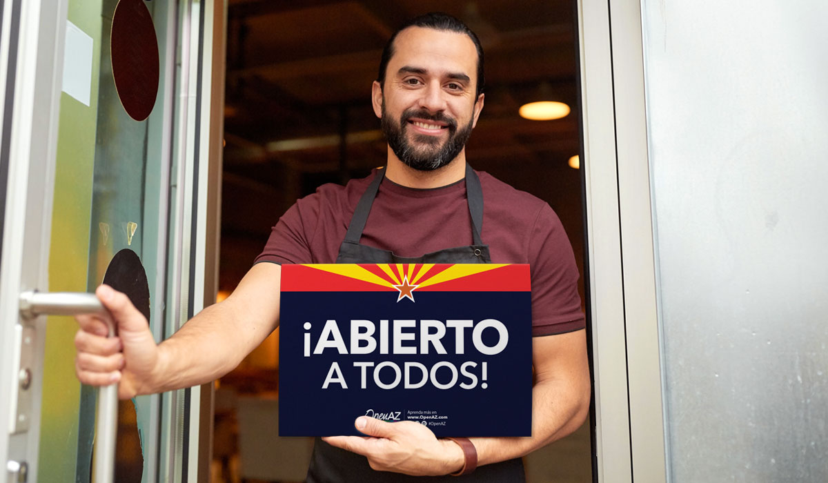 Businessman holding OpenAZ Official Sign Open for Business to Everyone