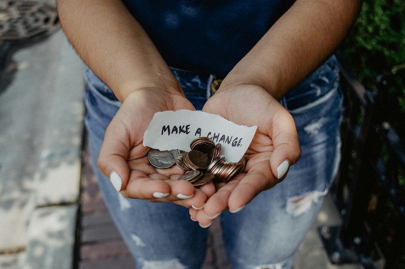 Woman holding coins in her hands