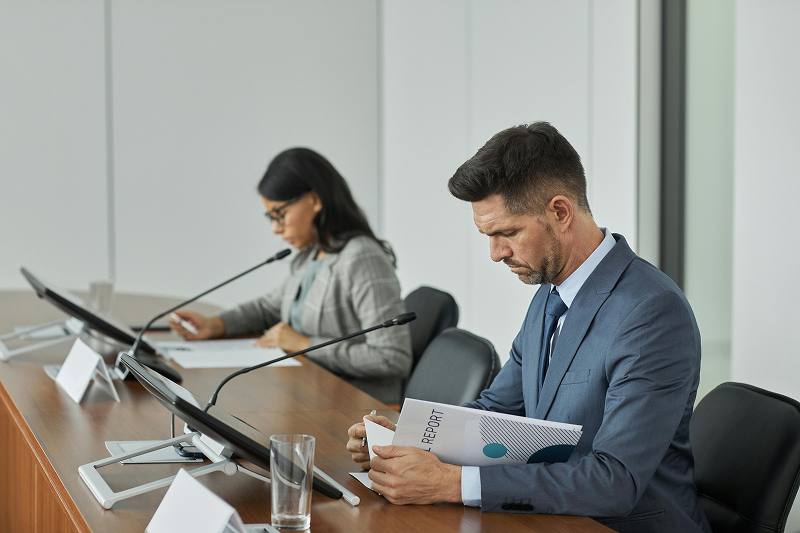 People at table reading report