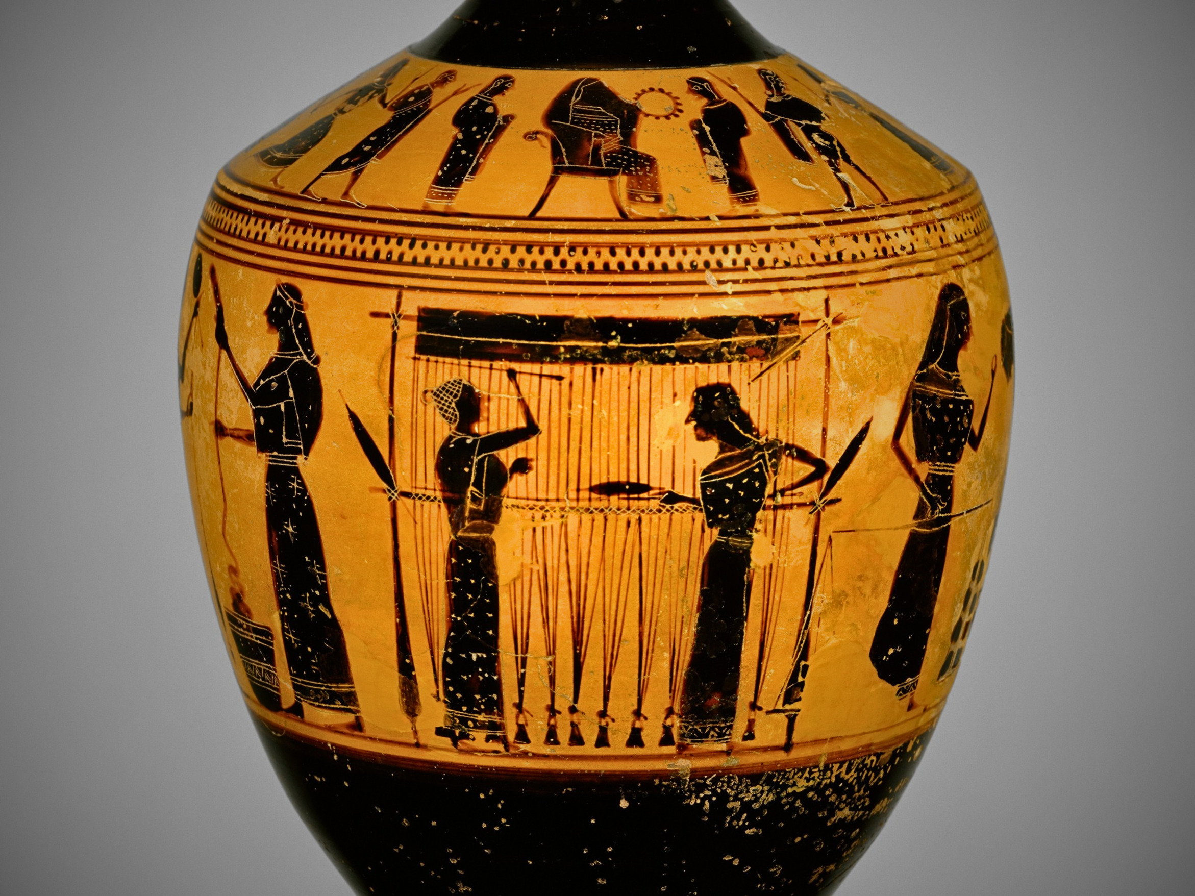 Terracotta blackfigure lekythos depicting women spinning wool and weaving, attributed to the Amasis painter, ca. 550-530 BCE.