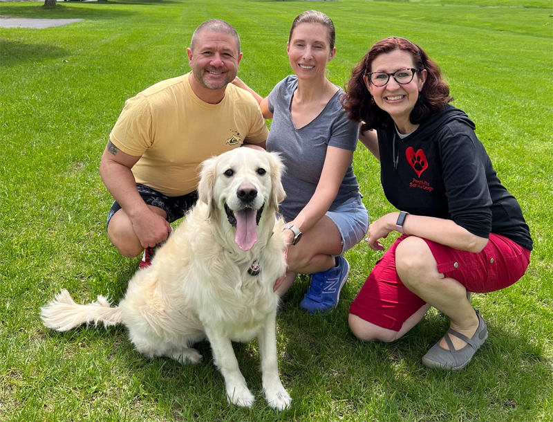 Sunny the service dog and her family plus our head trainer