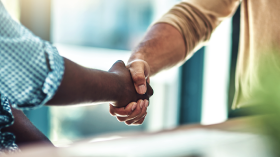 Two workers shaking hands