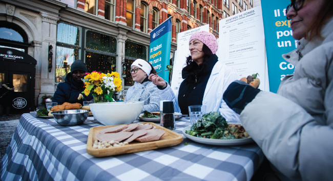 People sitting around a table with food