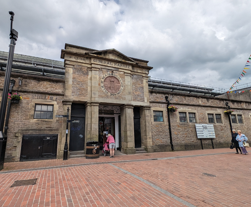 A photograph of the outside of Neath Market, taken from Queen Street.