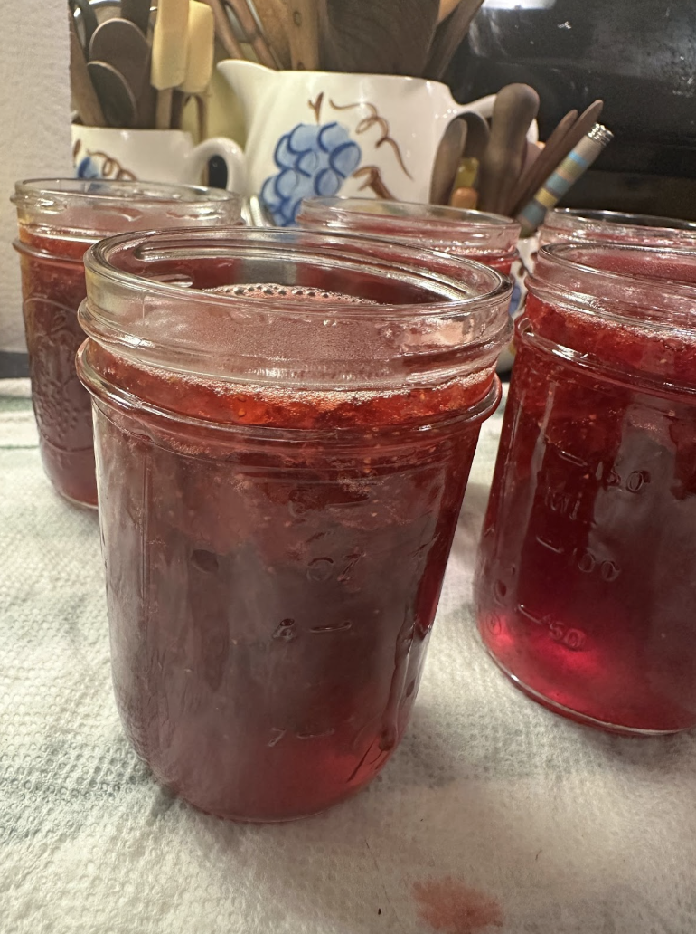 Strawberry jam in mason jar on counter