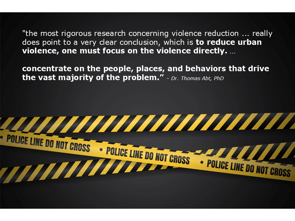 Quote from Dr. Thomas Abt on reducing urban violence over a dark background with yellow POLICE LINE DO NOT CROSS tape.