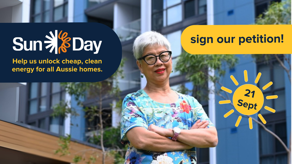 Lady in front of high rise building - help us unlock cheap clean energy for all Aussie homes