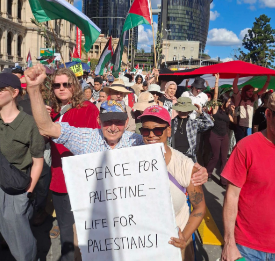 image of Trina with protester at Justice for Palestine rally on 24 August 2025 holding a sign that says "Peace for Palestine"