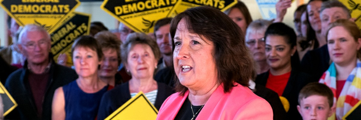 Christine Jardine speaking at a rally in front of supporters.