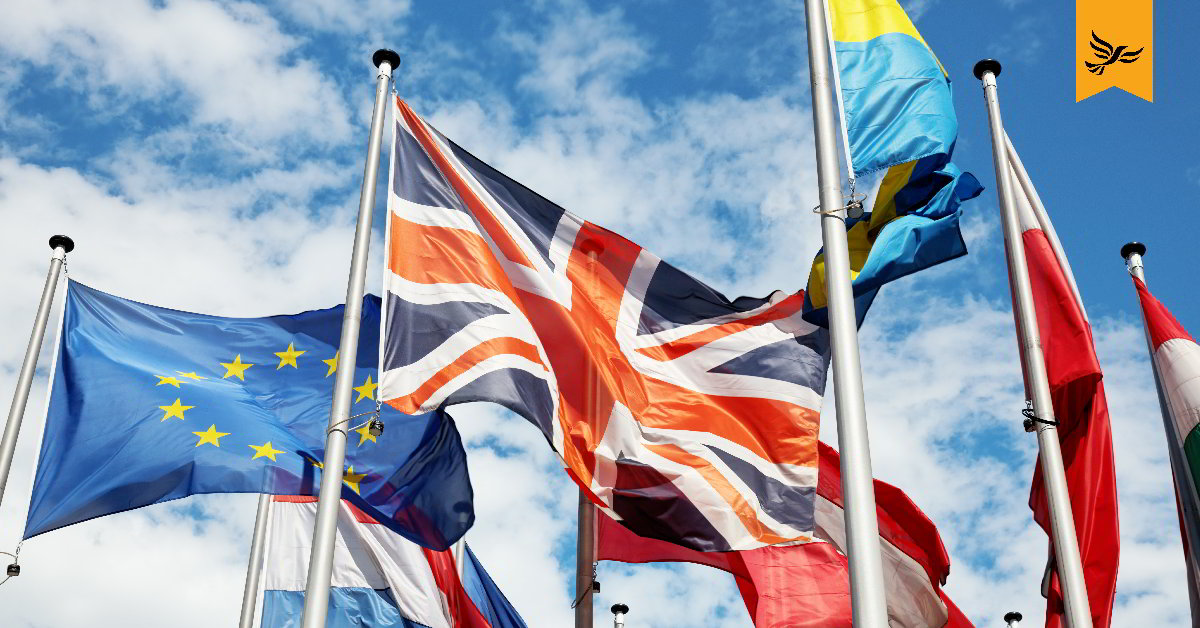 The union flag flying next to the EU flag.