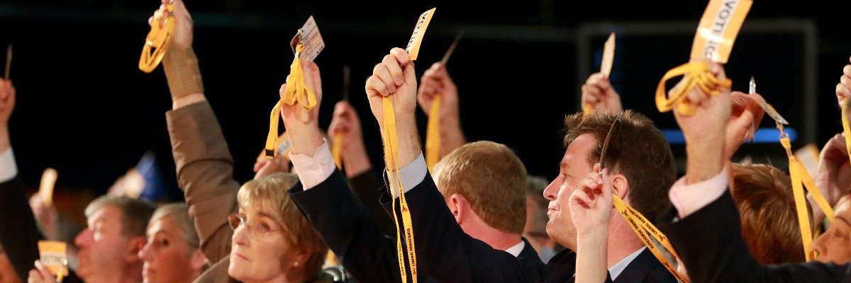 Lib Dem conference delegates voting.