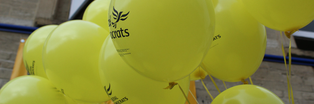 A cluster of Liberal Democrat balloons.