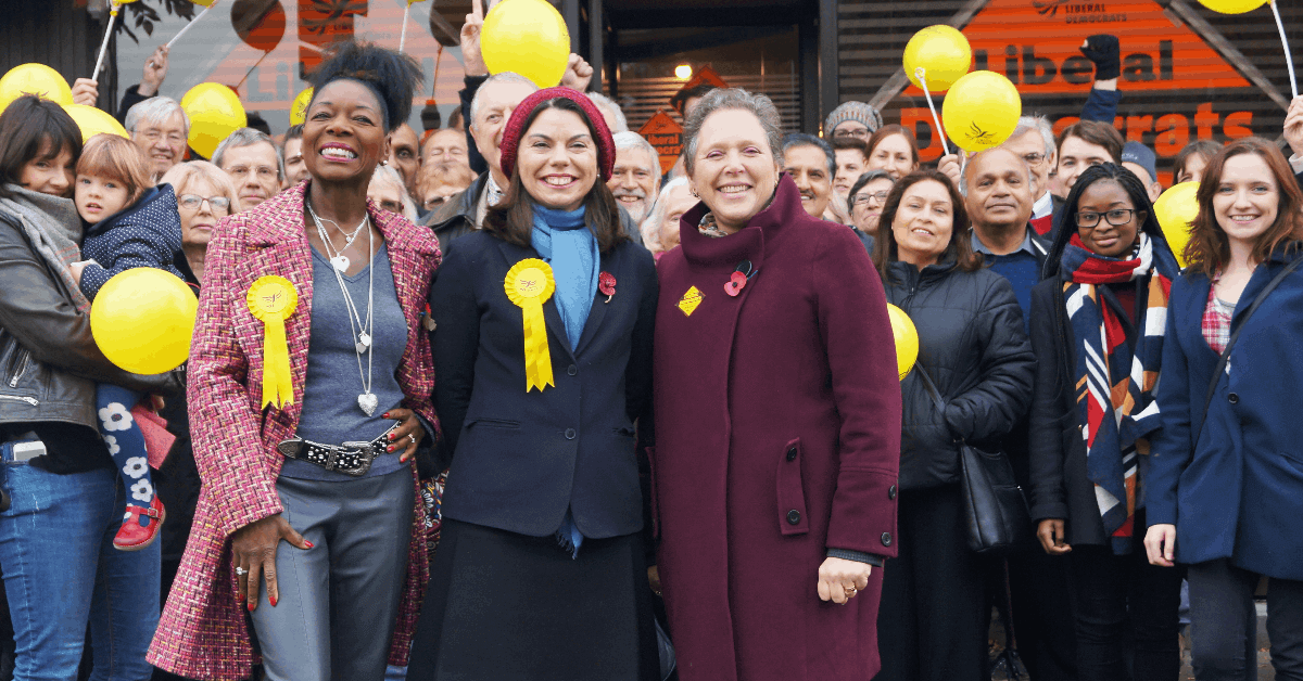 Floella Benjamin, Sarah Olney and Susan Kramer with a crowd of people