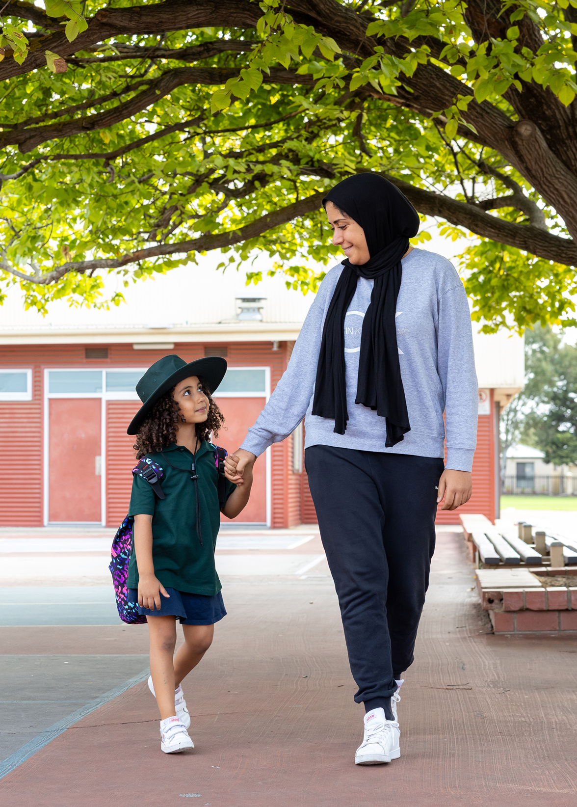 Parent and child walking to school