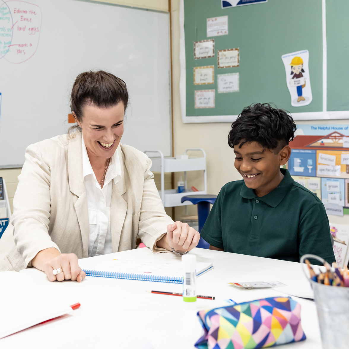 Teacher working with student