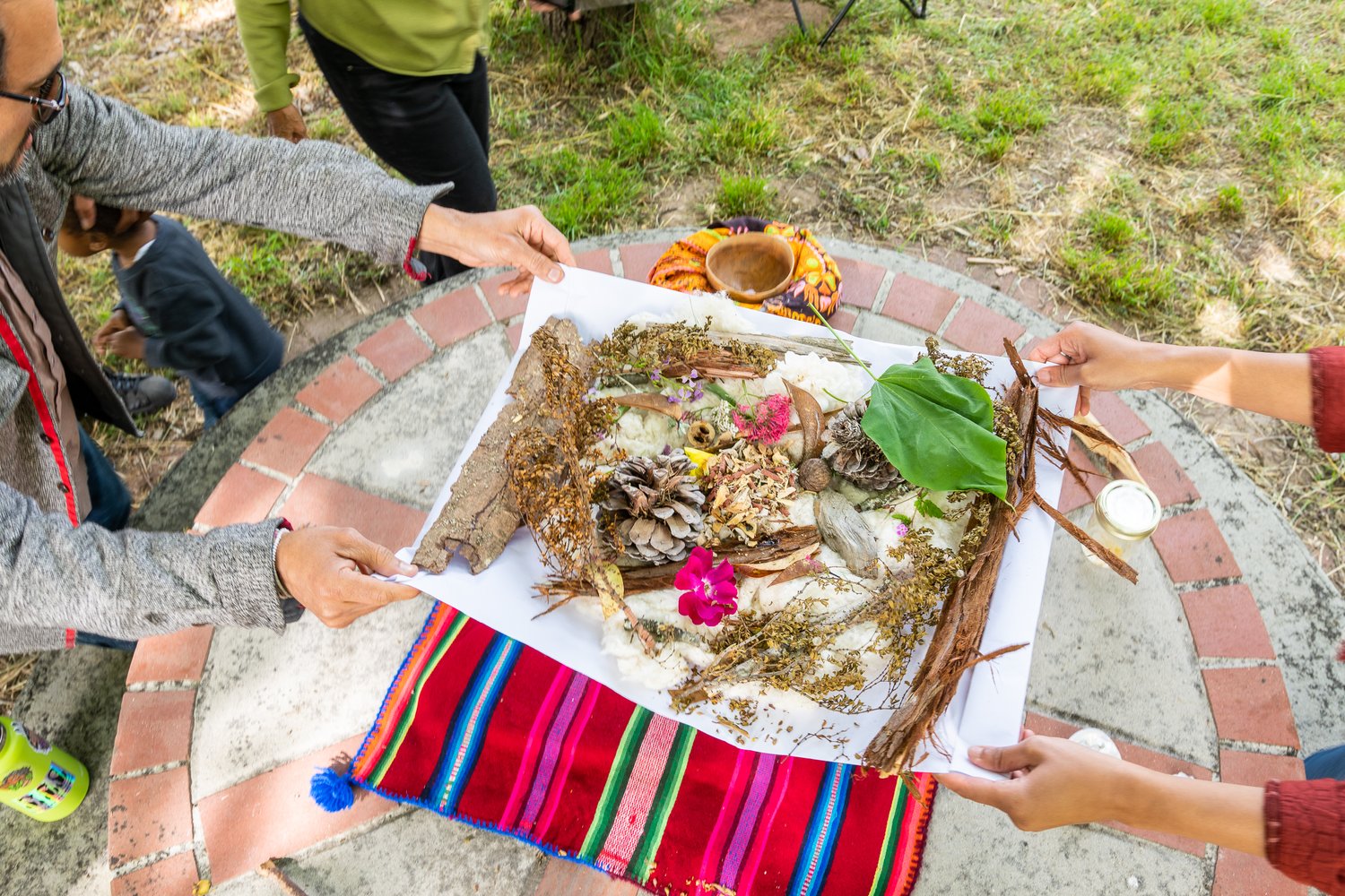 mesa ofrenda offering being taken to burn