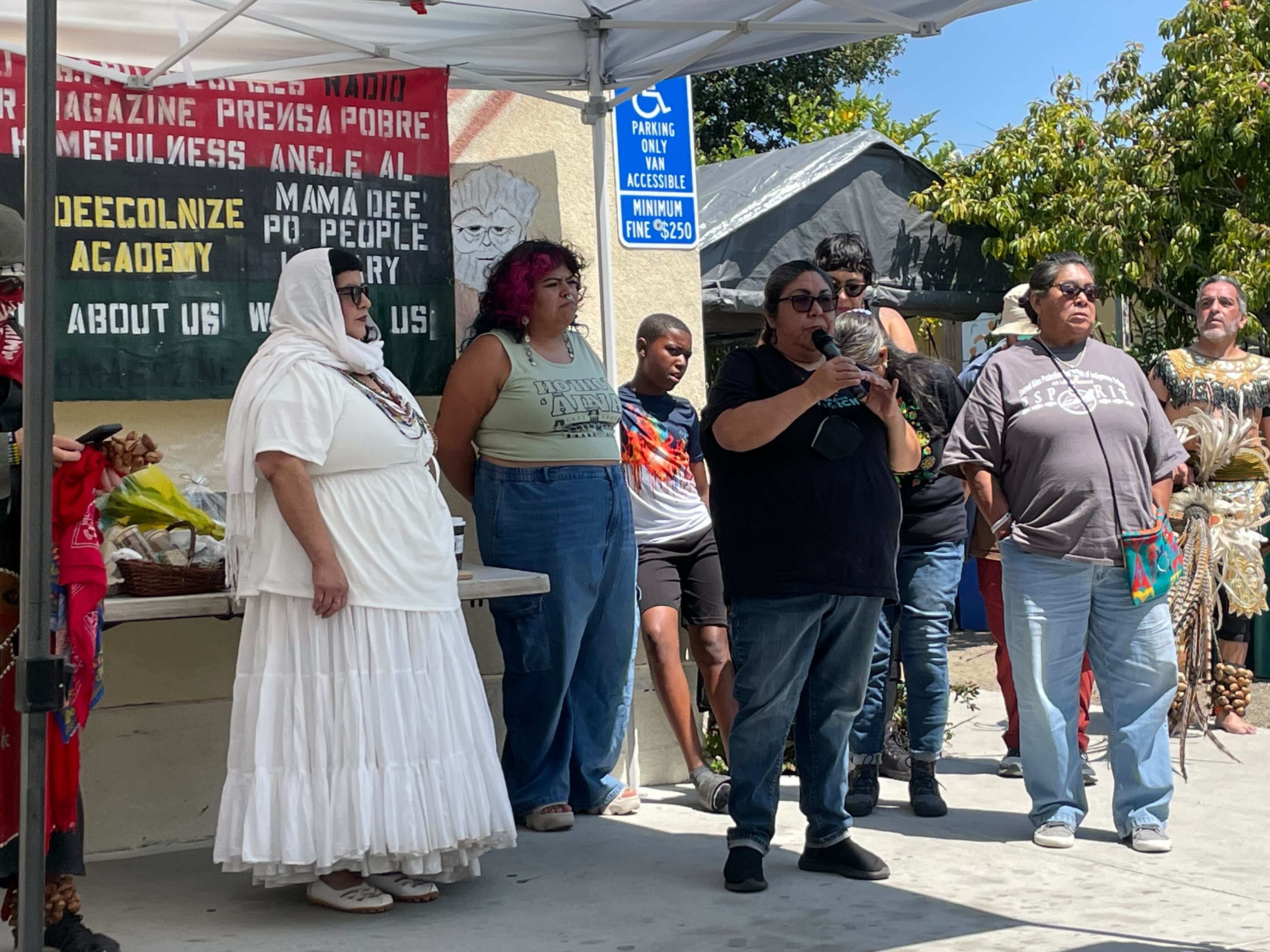 Sogorea Te Land Trust and Homefulness 1 representatives address the audience