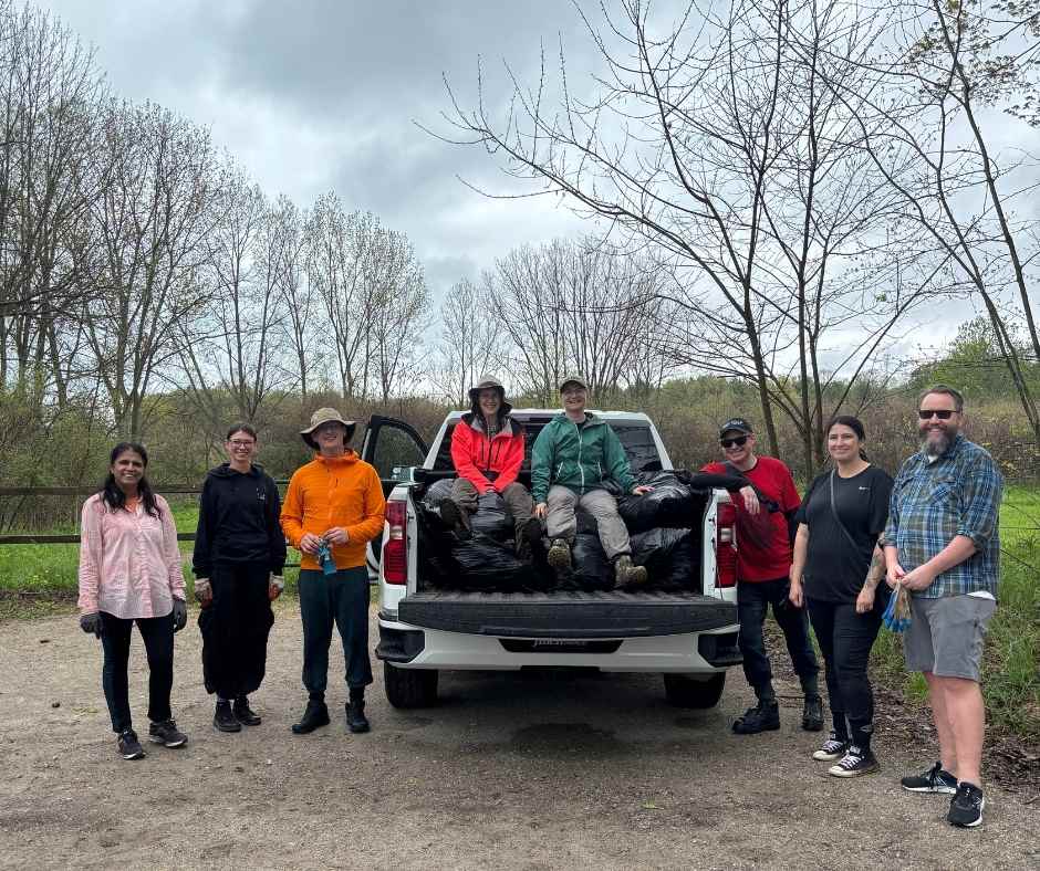 volunteers around truck after pulling garlic mustard