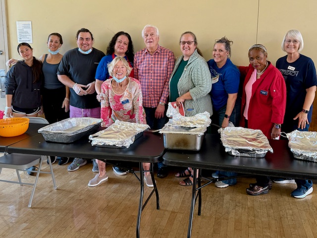 Photo of Ken Medema with UCO staff and volunteers
