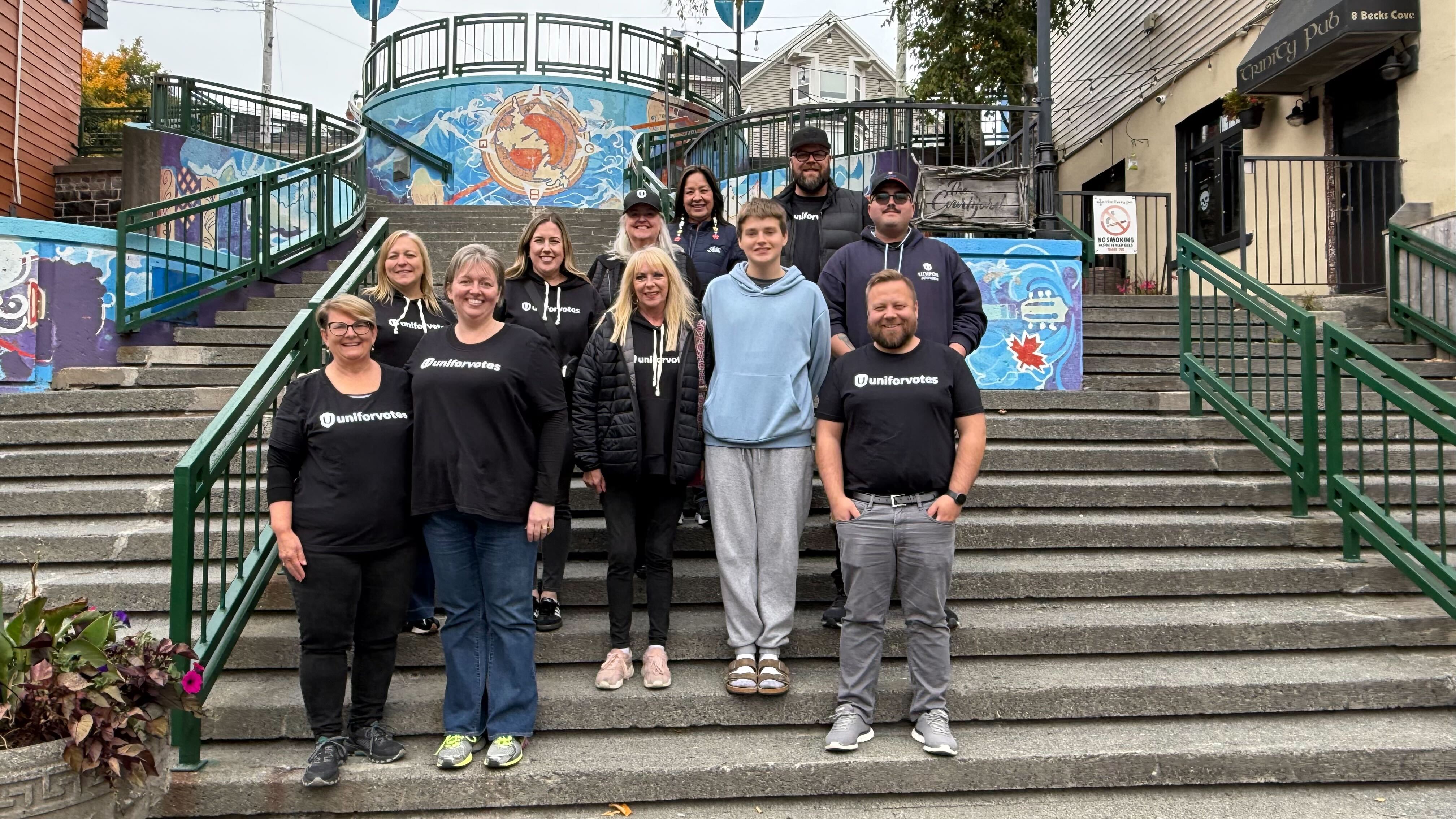 A group of Unifor members stand with Atlantic Regional Director Jennifer Murray in St. John's wearing Unifor Votes t-shirts